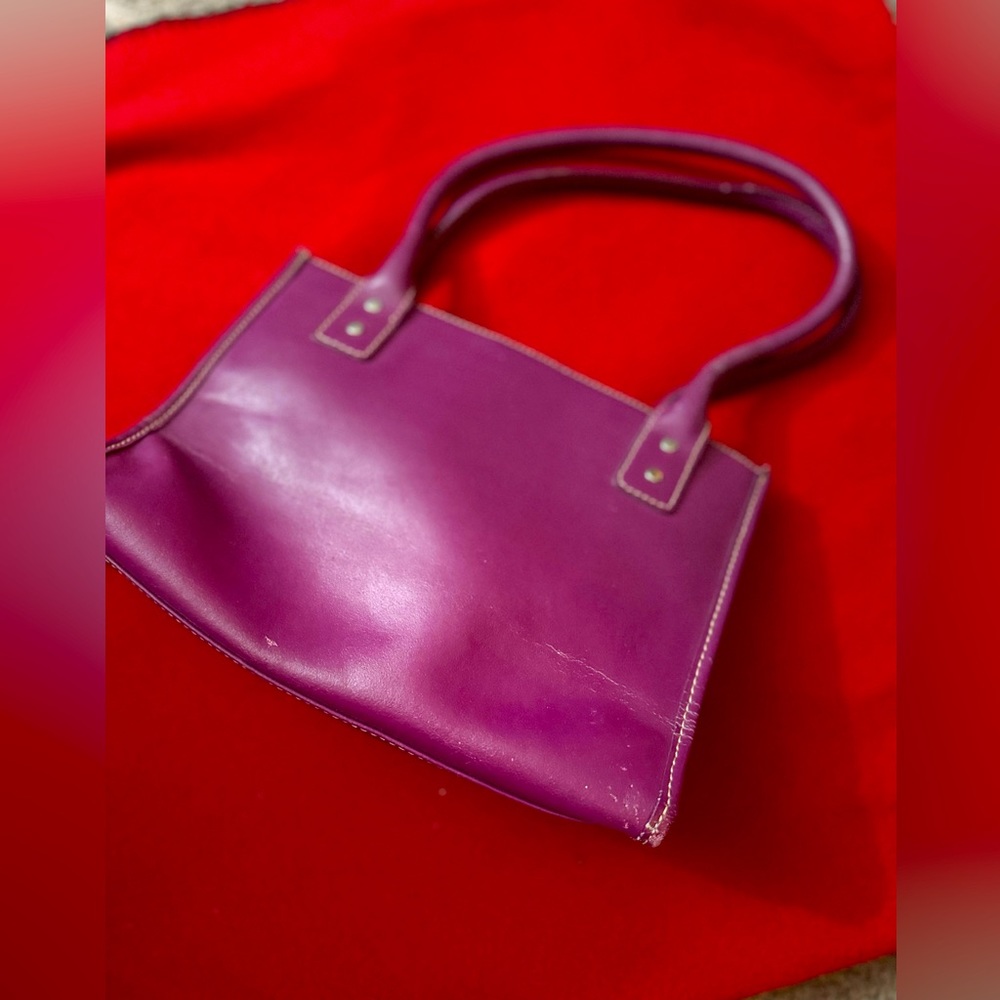 Magenta leather handbag